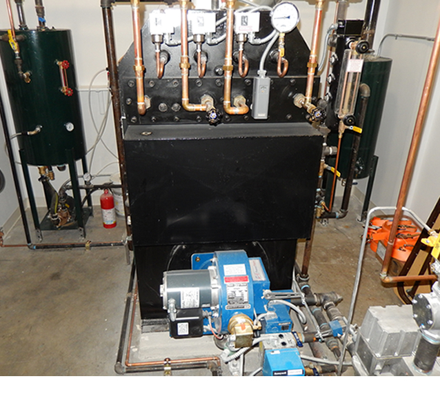 Behind the boiler to the left and right are the condensate/water feed system and the blow down system.