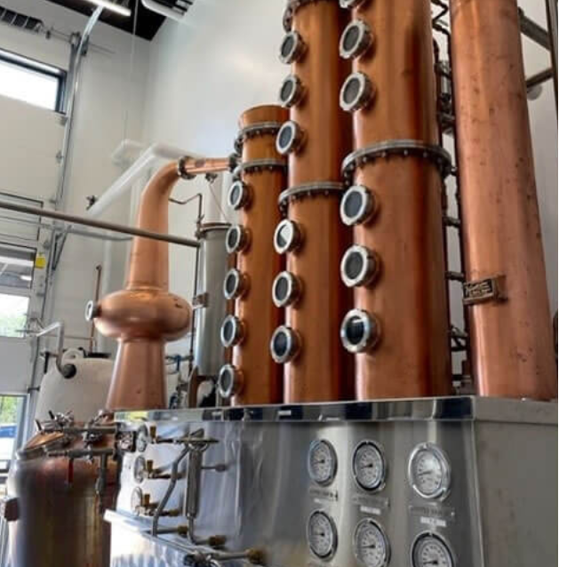 The distillery's stainless steel and copper condenser separates alcohol from water.