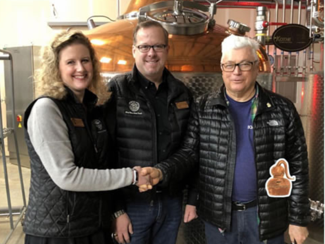 Trail Distilling's Sara and Jerry Brennan with ADI president, Bill Owens. ADI selected Trail Distilling to host two-days of hands-on vodka making workshops during ADI's 2018 int'l conference, held in Portland, OR.