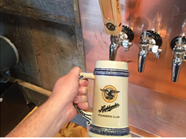 Highlander beer tap and commemorative ceramic beer mug