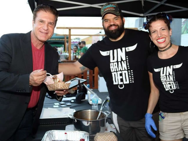 Hialeah Mayor Hernandez enjoys Unbranded BBQ brisket at the Hialeah block party.