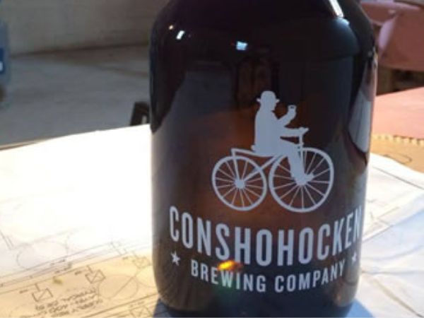 One of many 64 oz glass growlers which will soon be filled will Conshohocken craft beer.