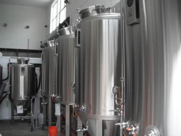 Magnificent stainless steel fermenting tanks.