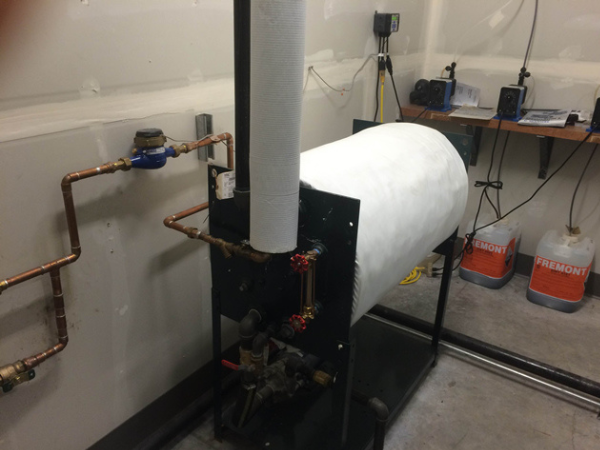 Columbia boiler horizontal condensate/water feed device with integrated pump and optional insulation; insulation installed onsite.