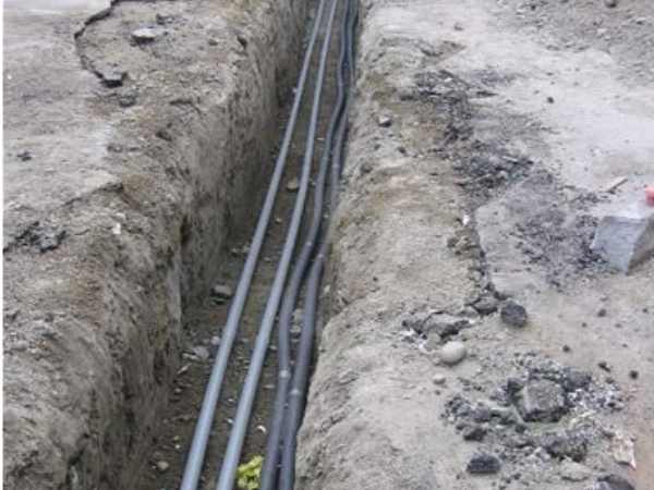 Hot water lines from new building to existing building will provide hydronic heat for existing building.