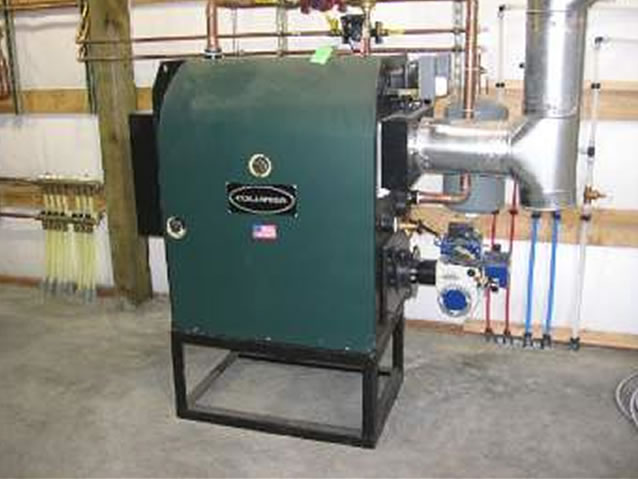 This Columbia KWO waste oil fired boiler with Shenandoah B-10 burner heats hot water which circulates through the PEX tubing to heat the facility.