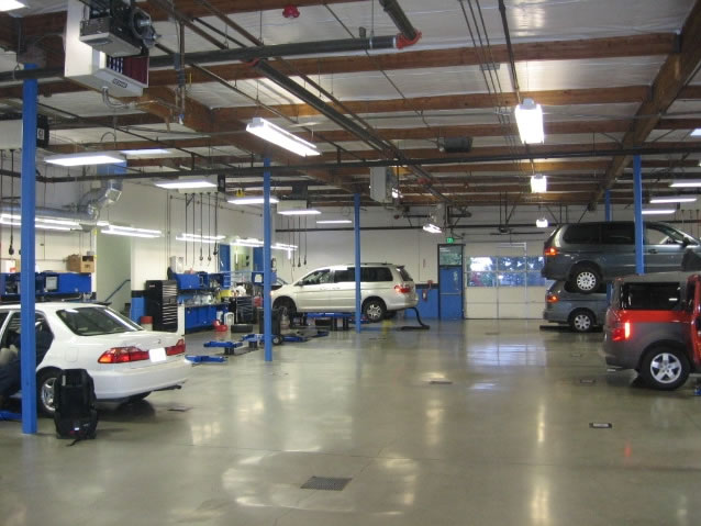 Automotive service area heated with 3 hot water hydronic unit heaters.