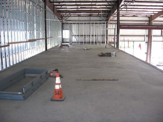 View from mezzanine of completed concrete floor in main shop area.