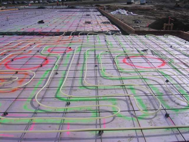 Close up of PEX tubing being installed.