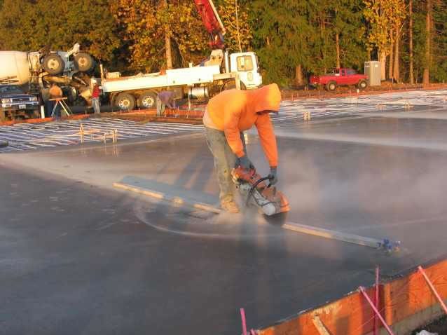 Saw cutting slab for expansion joint.