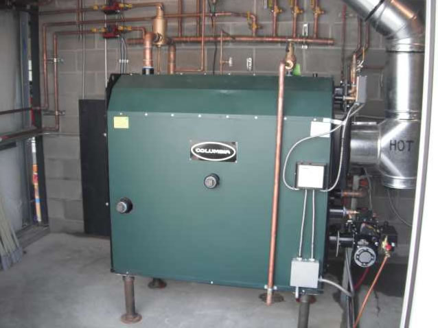 KWO 500 waste oil fired boiler installed for radiant floor heating system.