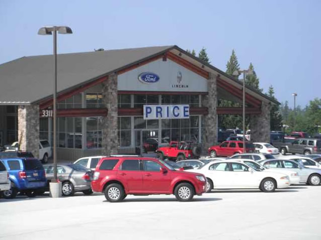 Construction finished. Auto dealership and service facility open for business.