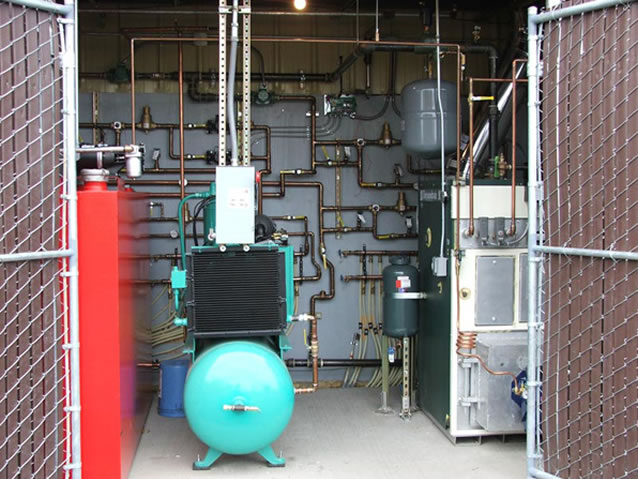 Radiant floor system. Columbia used oil fired boiler at right.