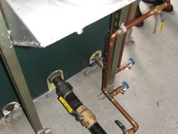 Radiant floor system connection to waste oil boiler.